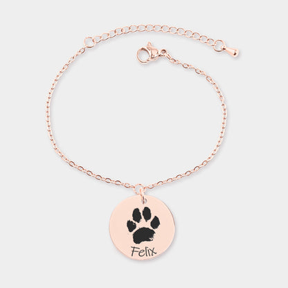brazalete de oro rosa personalizado grabado con la huella de una mascota