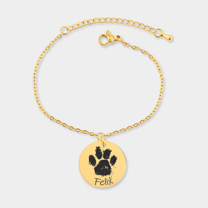 brazalete de oro personalizado grabado con la huella de una mascota